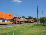 BNSF 235, an ex-Santa Fe, helps lead a container train south through Norman.